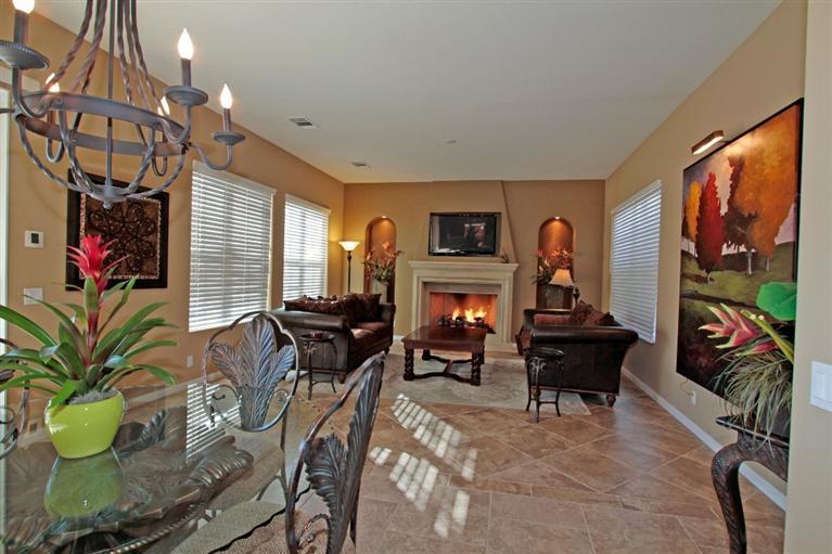 3 Via Santa Elena Rancho Mirage, CA 92270 - Photo 22 of 33 a living room with furniture a fireplace and a flat screen tv