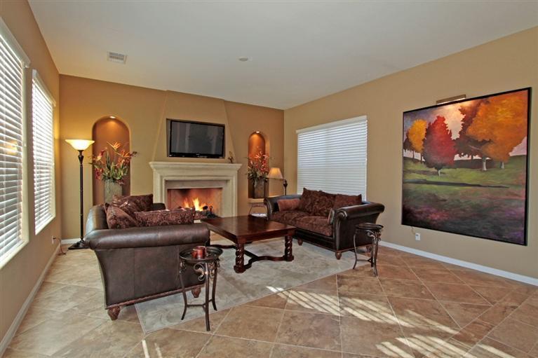 3 Via Santa Elena Rancho Mirage, CA 92270 - Photo 23 of 33 a living room with furniture a flat screen tv and a fireplace