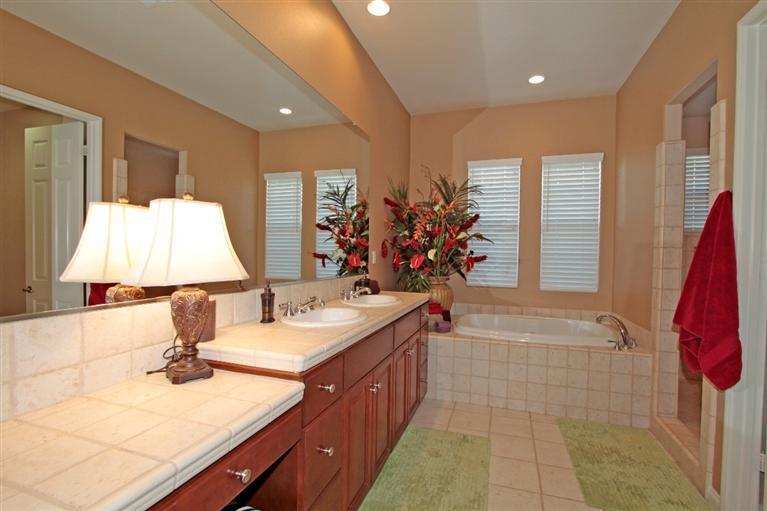 3 Via Santa Elena Rancho Mirage, CA 92270 - Photo 25 of 33 a bathroom with a double vanity sink and a mirror