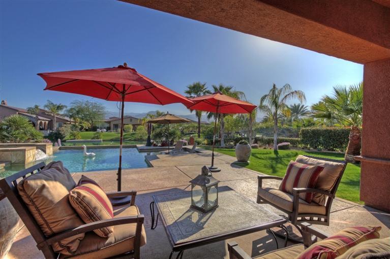 3 Via Santa Elena Rancho Mirage, CA 92270 - Photo 5 of 33 a view of patio with chairs and table under an umbrella