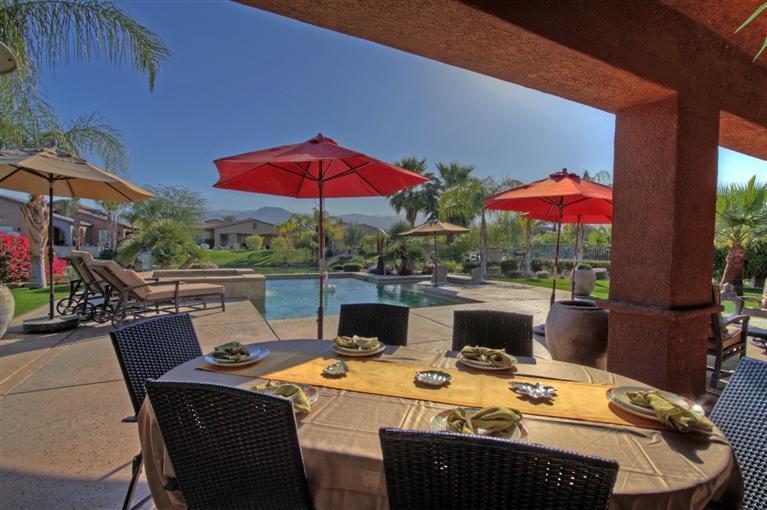 3 Via Santa Elena Rancho Mirage, CA 92270 - Photo 6 of 33 a view of a patio with furniture and table under an umbrella