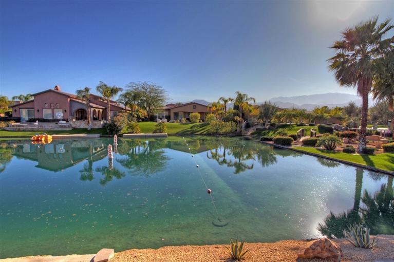 3 Via Santa Elena Rancho Mirage, CA 92270 - Photo 9 of 33 a view of a lake with a houses in the back