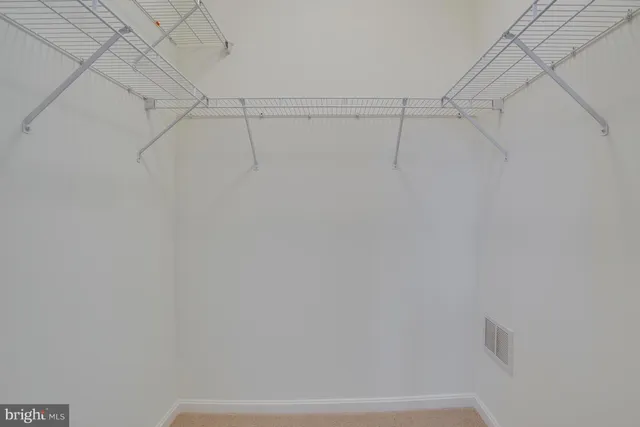 a view of small space with racks on the wall