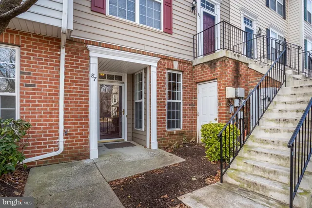 a view of a brick building with many windows