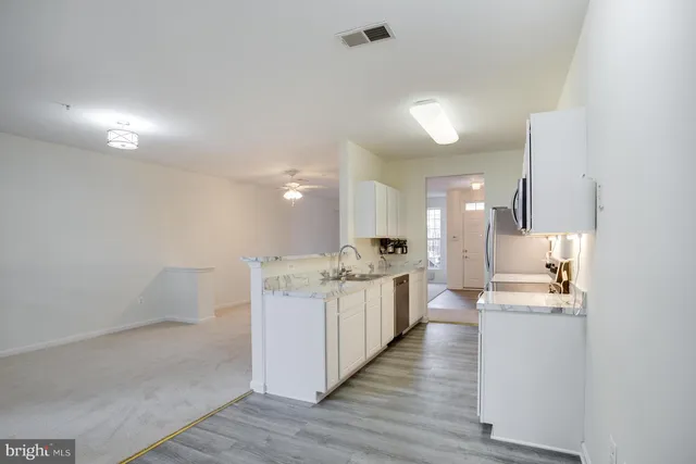 a kitchen with counter top space and sink