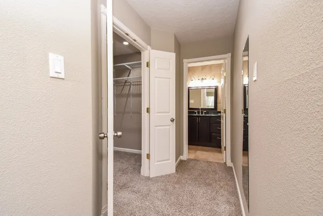 a view of a bathroom from a hallway