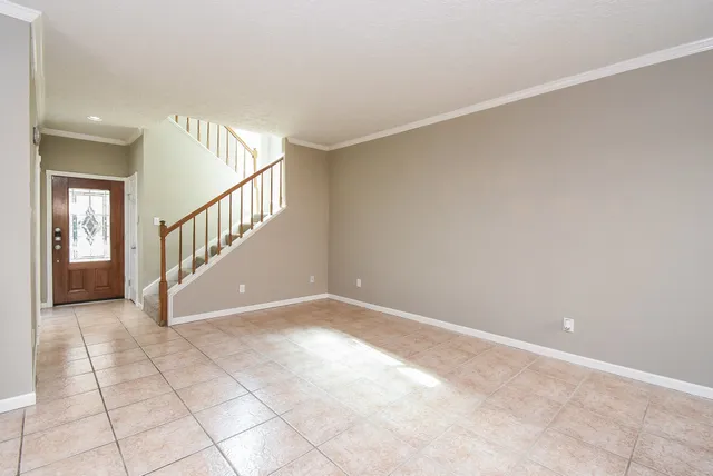 a view of an entryway with wooden floor