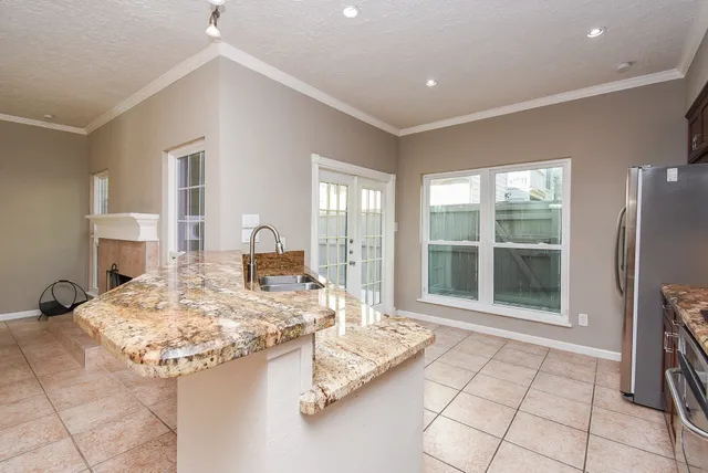 a living room with granite countertop furniture and a fireplace