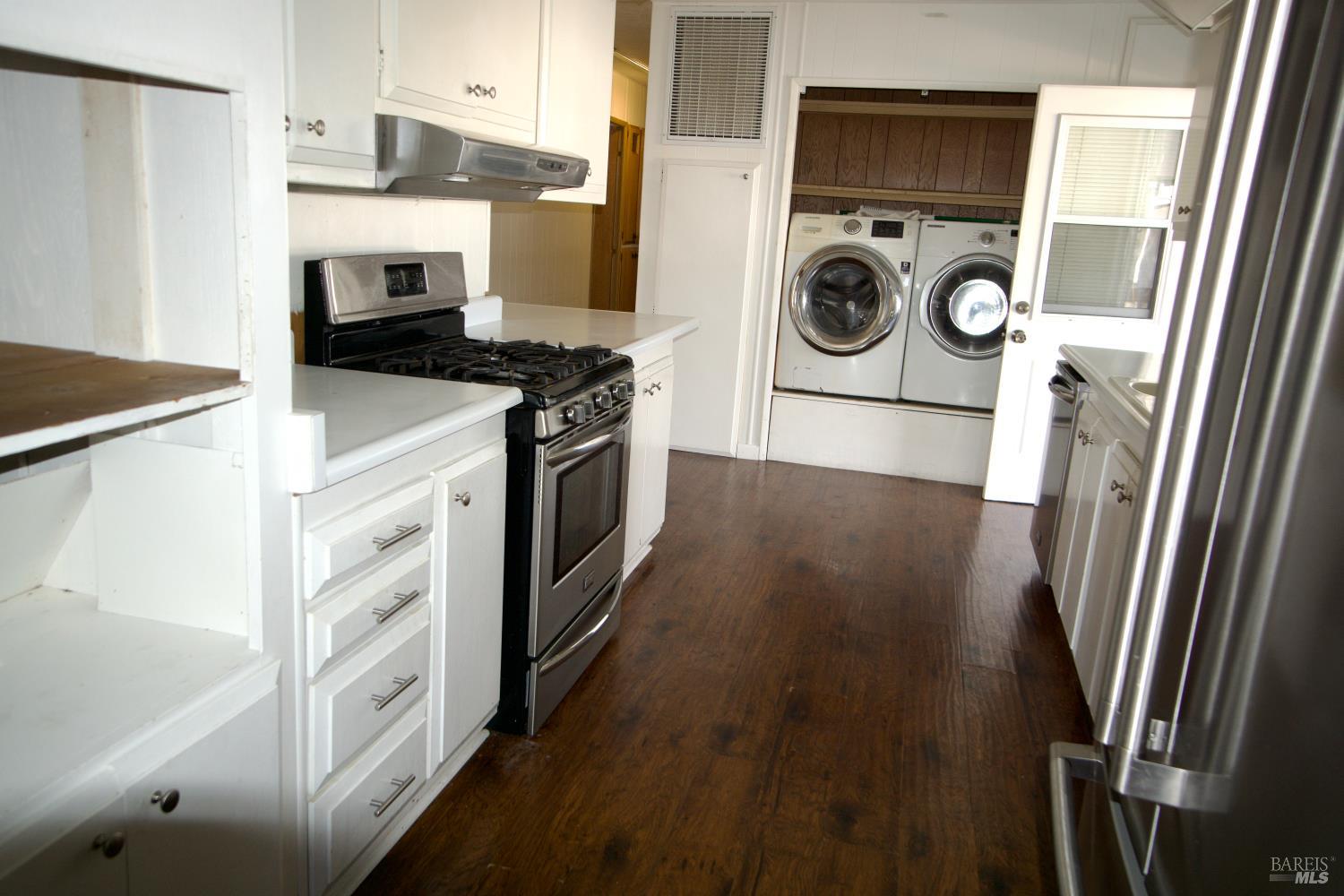 211 Colonial Park Drive Santa Rosa, CA 95403 - Photo 13 of 26 Kitchen looking toward washer and dryer and back door