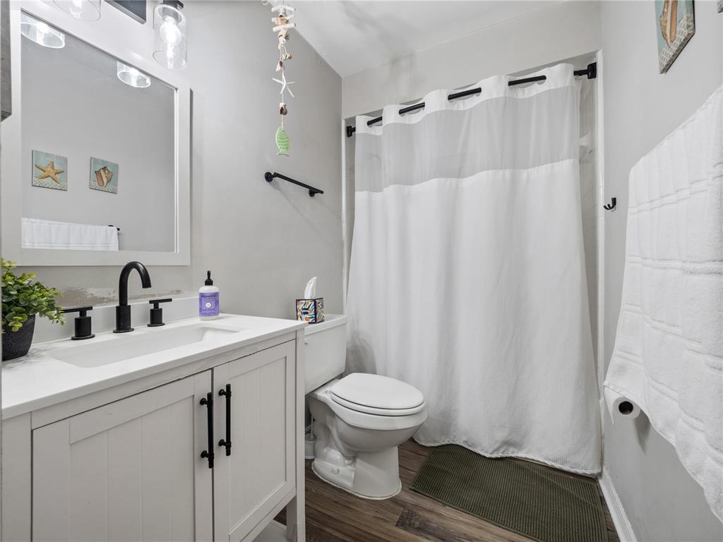 2733 Middle Street Orlando, FL 32807 - Photo 13 of 23 a bathroom with a sink toilet and shower