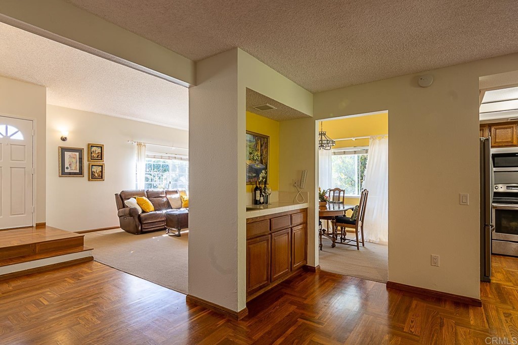 4738 Gateshead Road Carlsbad, CA 92010 - Photo 20 of 36 a view of a livingroom with furniture and wooden floor