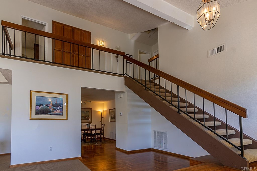 4738 Gateshead Road Carlsbad, CA 92010 - Photo 3 of 36 a view of entryway and hall with wooden floor