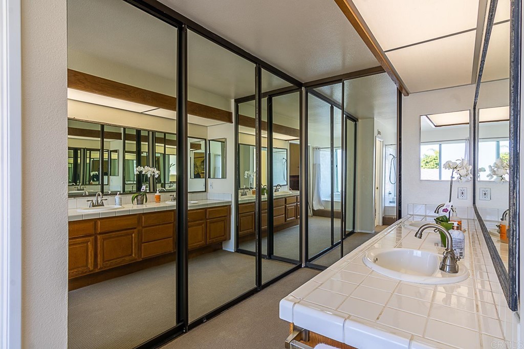 4738 Gateshead Road Carlsbad, CA 92010 - Photo 21 of 36 a spacious bathroom with a large tub and shower