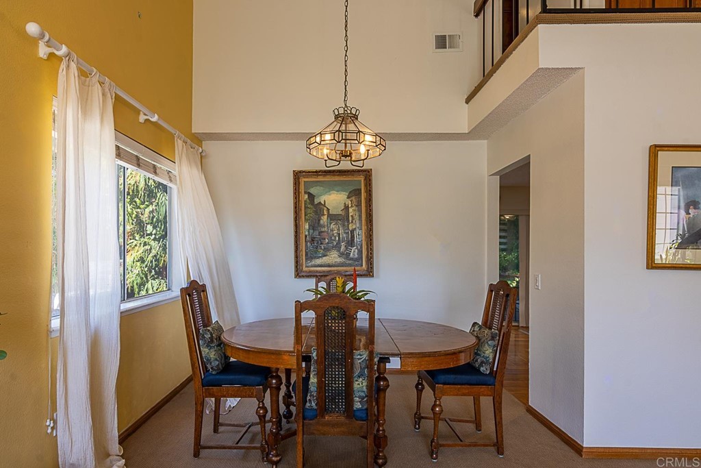 4738 Gateshead Road Carlsbad, CA 92010 - Photo 22 of 36 a view of a dining room with furniture and window