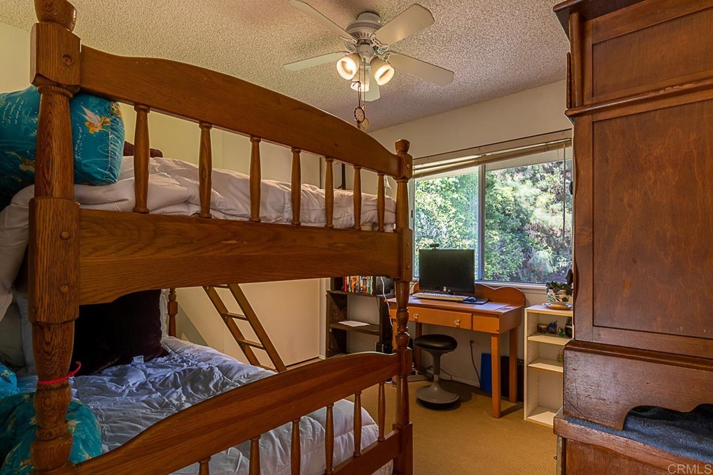 4738 Gateshead Road Carlsbad, CA 92010 - Photo 29 of 36 a view of a workspace with furniture and a window