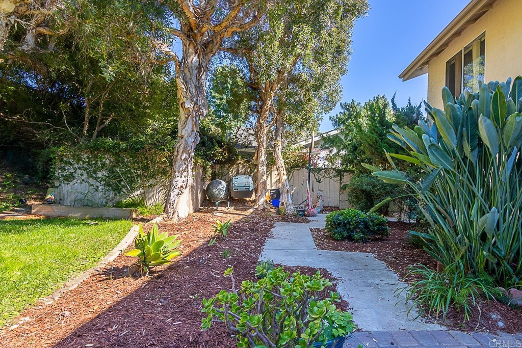 4738 Gateshead Road Carlsbad, CA 92010 - Photo 30 of 36 a view of a backyard with a garden