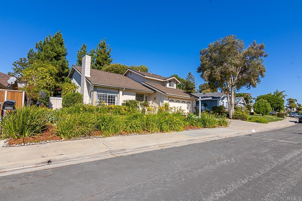 4738 Gateshead Road Carlsbad, CA 92010 - Photo 36 of 36 front view of a house with a yard and potted plants