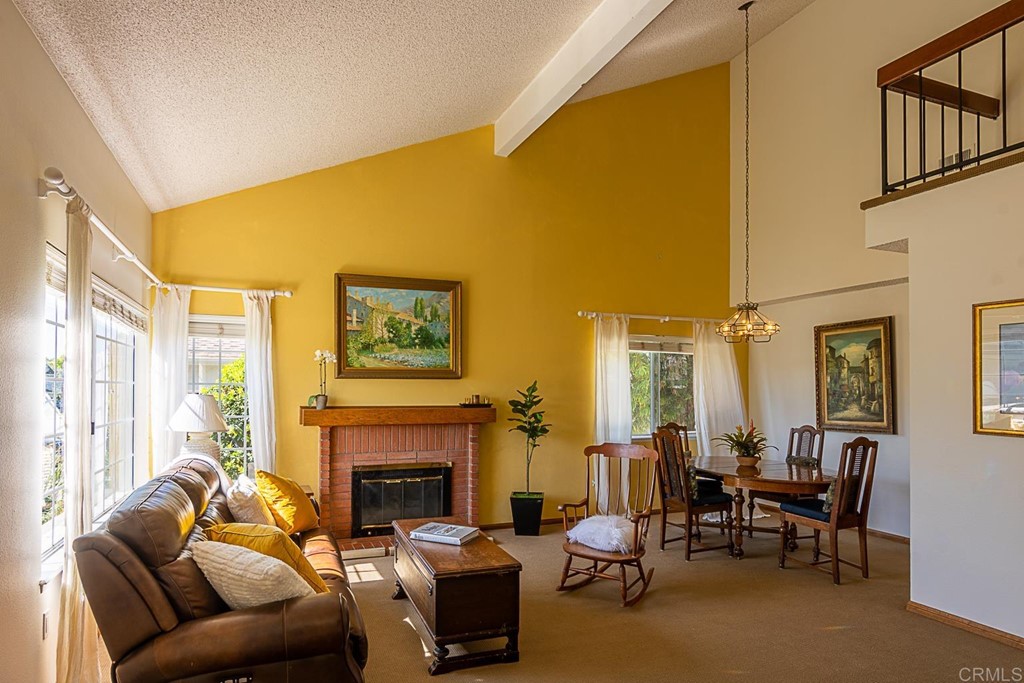 4738 Gateshead Road Carlsbad, CA 92010 - Photo 5 of 36 a living room with furniture windows and a fireplace