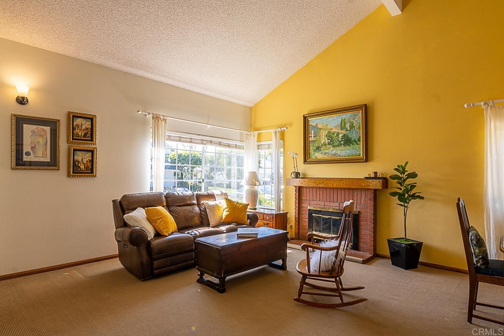 4738 Gateshead Road Carlsbad, CA 92010 - Photo 6 of 36 a living room with furniture and a fireplace