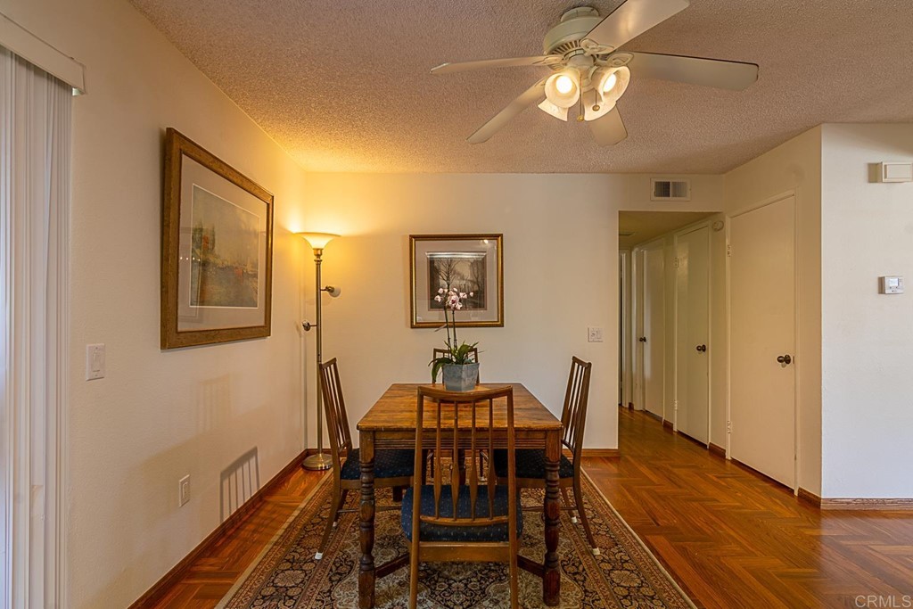 4738 Gateshead Road Carlsbad, CA 92010 - Photo 8 of 36 a view of a dining room with furniture and wooden floor