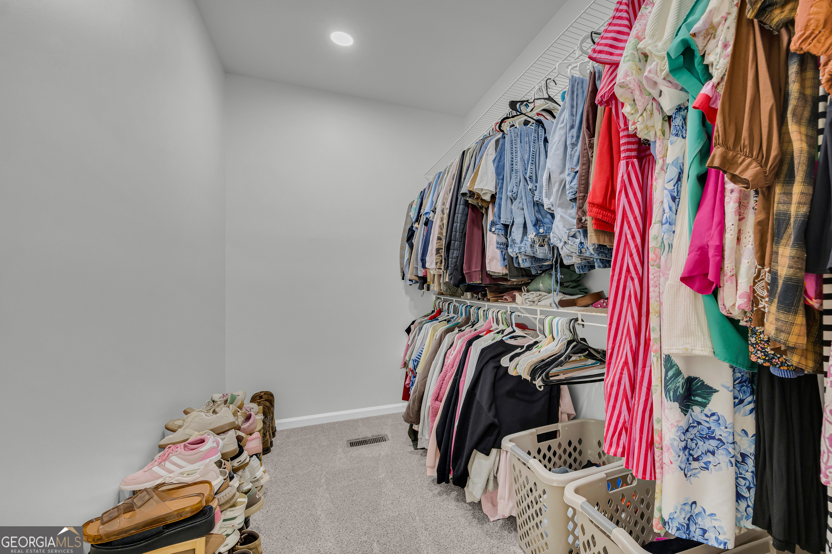 163 Tuxedo Drive Commerce, GA 30530 - Photo 39 of 62 a view of walk in closet with clothes and shoes
