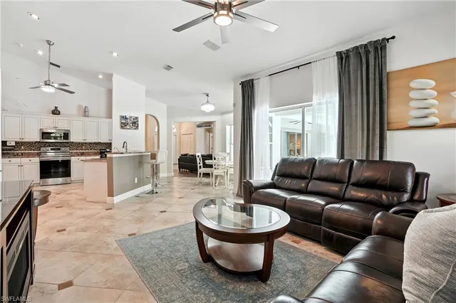 a dining room with furniture and a window