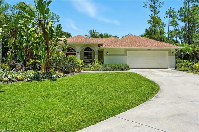 a bathroom with a glass shower door and a window