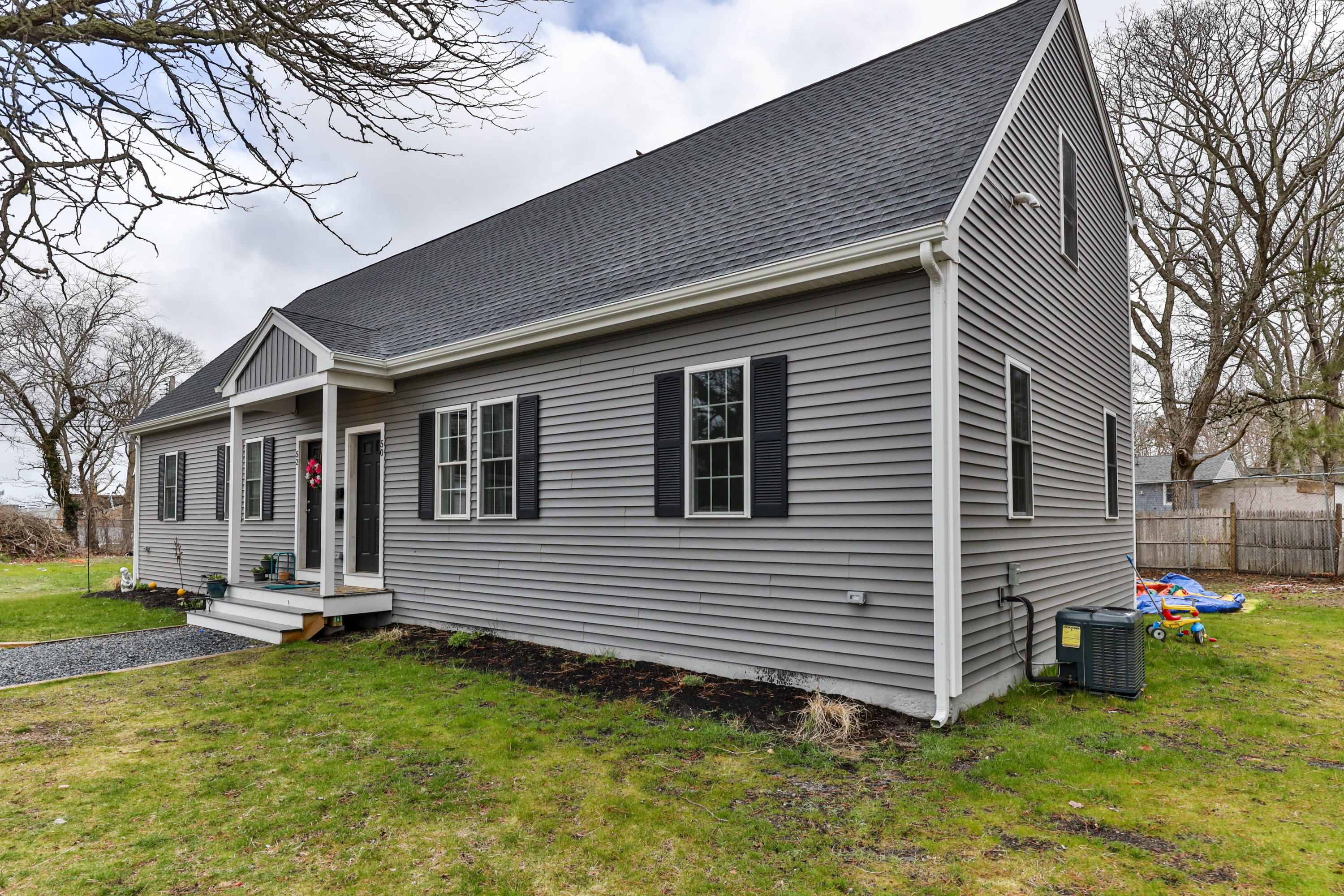 a front view of a house with a yard