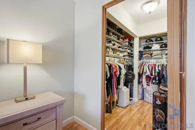a bathroom with a granite countertop toilet sink and mirror