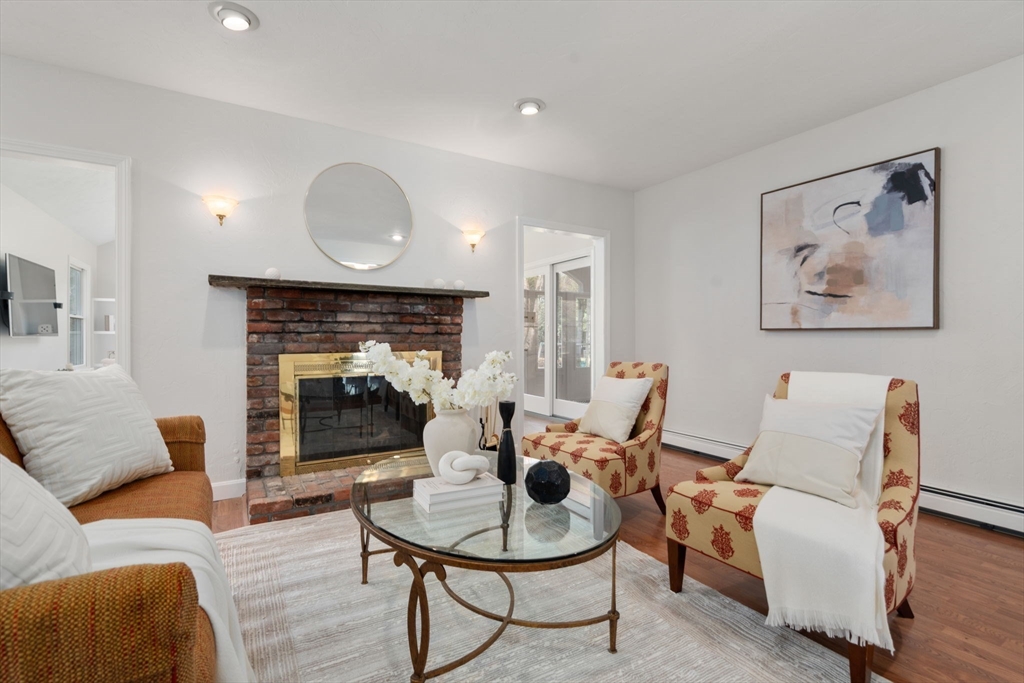 16 Blacksmith Drive Medfield, MA 02052 - Photo 13 of 40 a living room with furniture and a fireplace