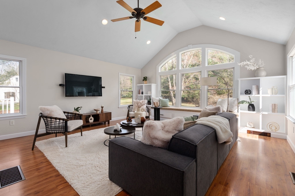 16 Blacksmith Drive Medfield, MA 02052 - Photo 17 of 40 a living room with furniture a ceiling fan and a large window