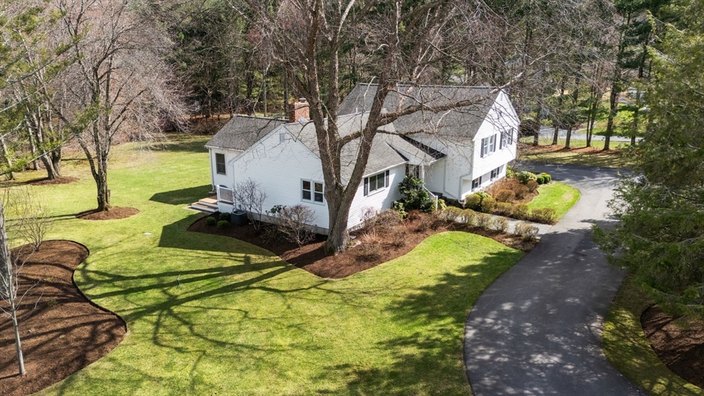16 Blacksmith Drive Medfield, MA 02052 - Photo 2 of 40 a backyard of a house with yard and outdoor seating