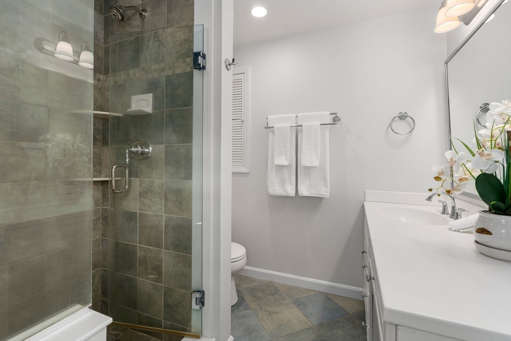 16 Blacksmith Drive Medfield, MA 02052 - Photo 21 of 40 a bathroom with a sink a toilet and shower