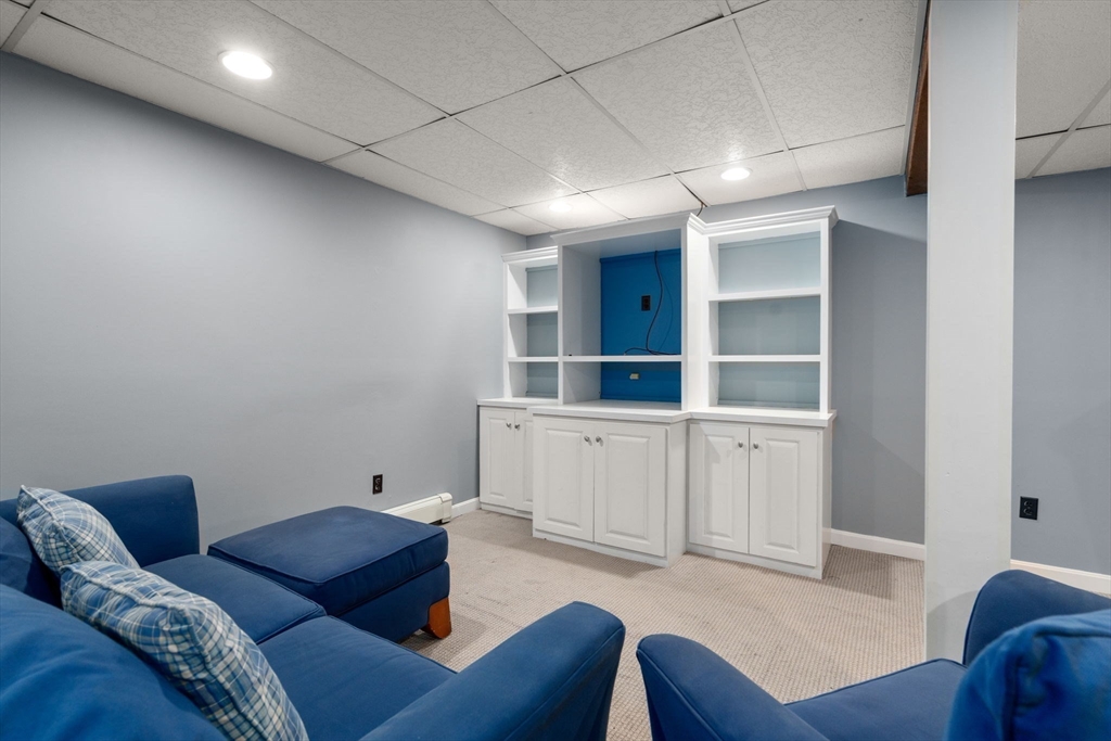 16 Blacksmith Drive Medfield, MA 02052 - Photo 29 of 40 a living room with furniture and white walls