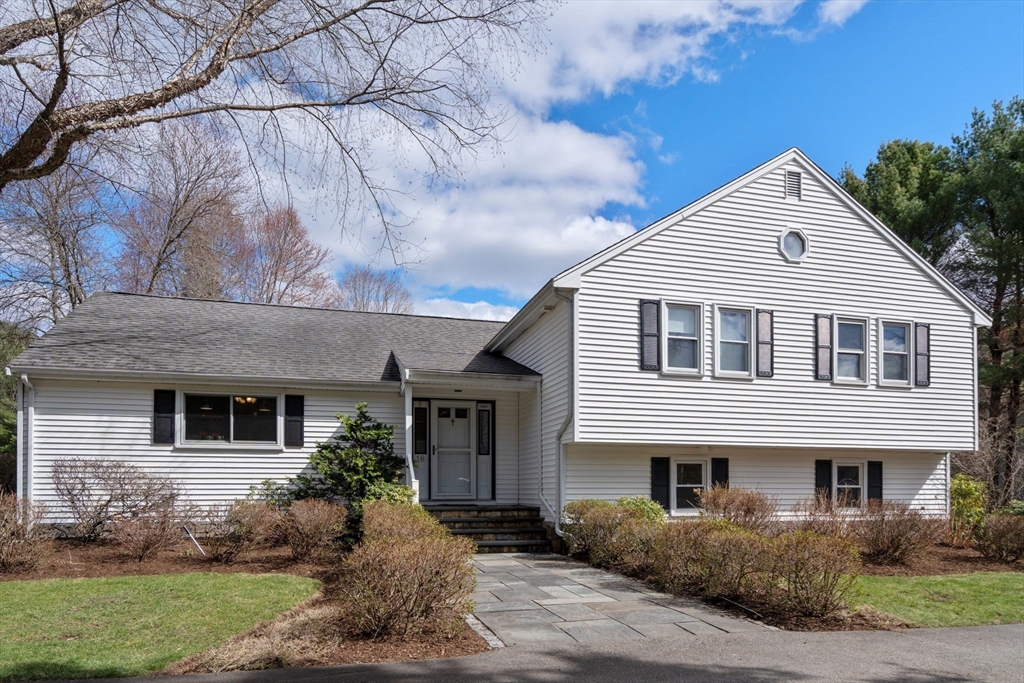 16 Blacksmith Drive Medfield, MA 02052 - Photo 3 of 40 a front view of a house with garden