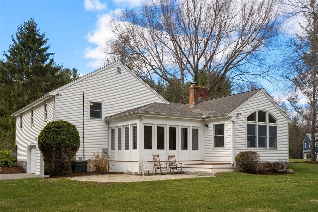 16 Blacksmith Drive Medfield, MA 02052 - Photo 35 of 40 a front view of a house with a yard