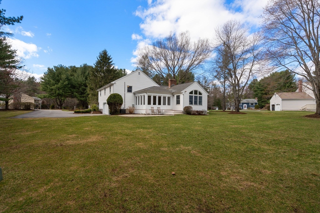 16 Blacksmith Drive Medfield, MA 02052 - Photo 37 of 40 a front view of house with yard and green space