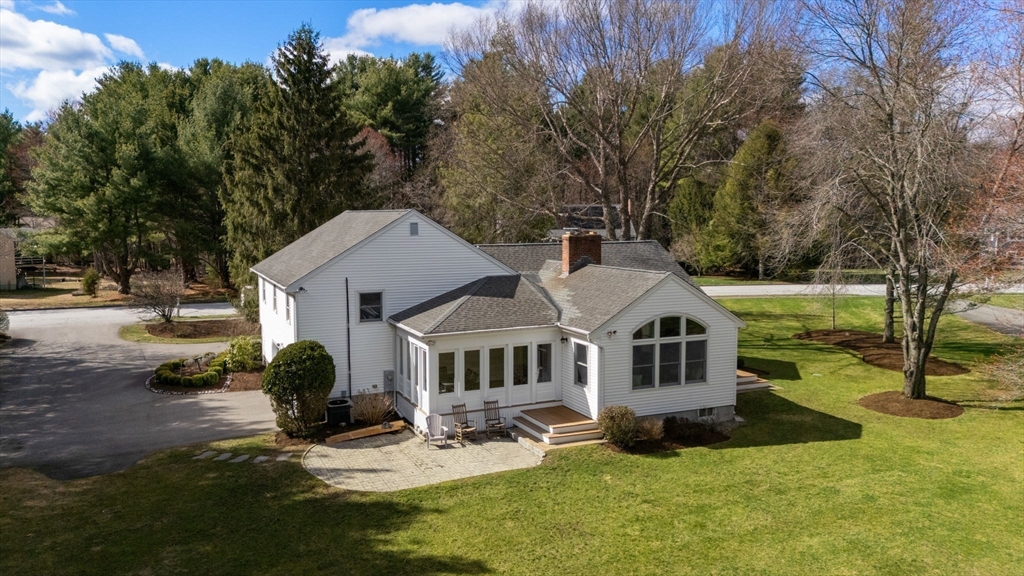 16 Blacksmith Drive Medfield, MA 02052 - Photo 38 of 40 a front view of a house with garden