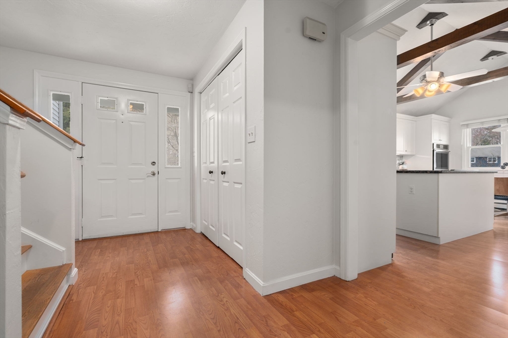 16 Blacksmith Drive Medfield, MA 02052 - Photo 4 of 40 a view of a room with wooden floor and a kitchen