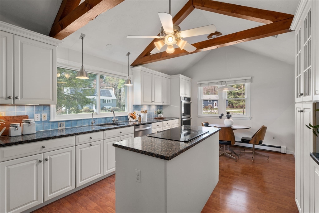 16 Blacksmith Drive Medfield, MA 02052 - Photo 5 of 40 a kitchen with stainless steel appliances granite countertop a sink and dishwasher with wooden floor