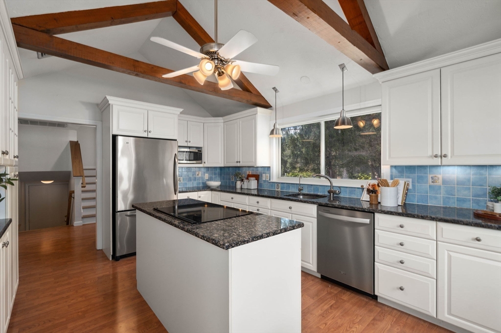 16 Blacksmith Drive Medfield, MA 02052 - Photo 6 of 40 a kitchen with stainless steel appliances granite countertop a sink a stove a refrigerator and island with wooden floor
