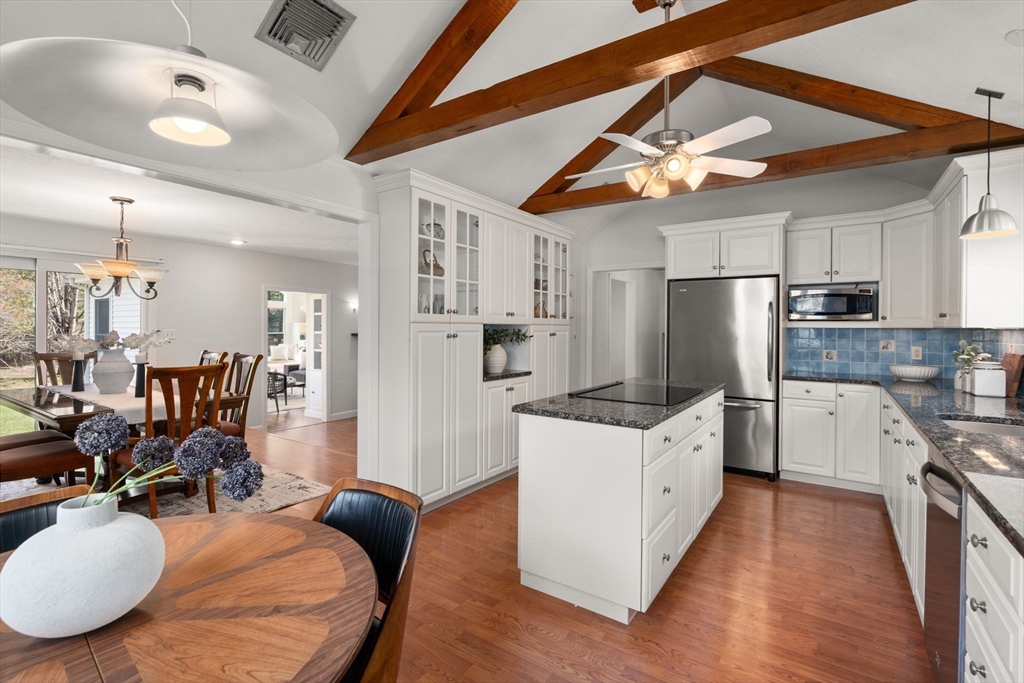 16 Blacksmith Drive Medfield, MA 02052 - Photo 9 of 40 a kitchen with stainless steel appliances granite countertop a sink stove and refrigerator