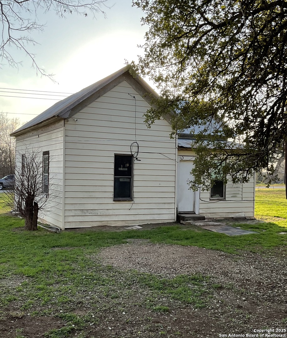 108 4th Street Sutherland Springs, TX 78161 - Photo 3 of 9 a view of a house with a yard