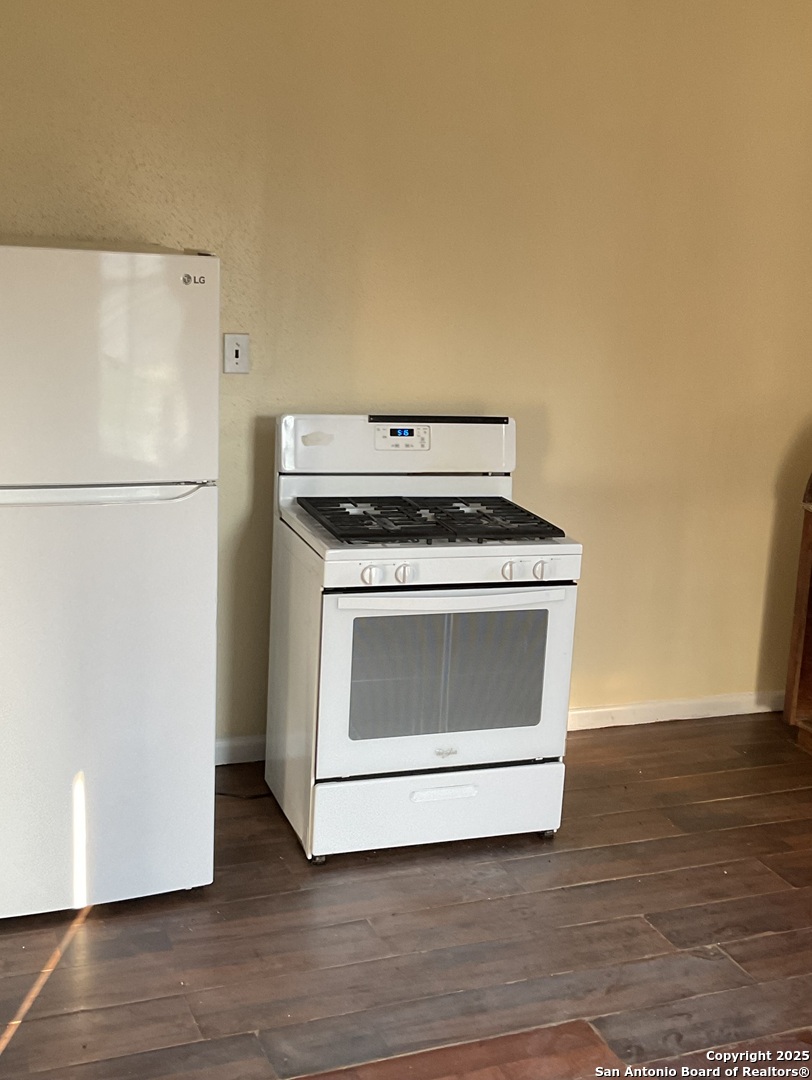 108 4th Street Sutherland Springs, TX 78161 - Photo 7 of 9 a stove top oven sitting inside of a kitchen