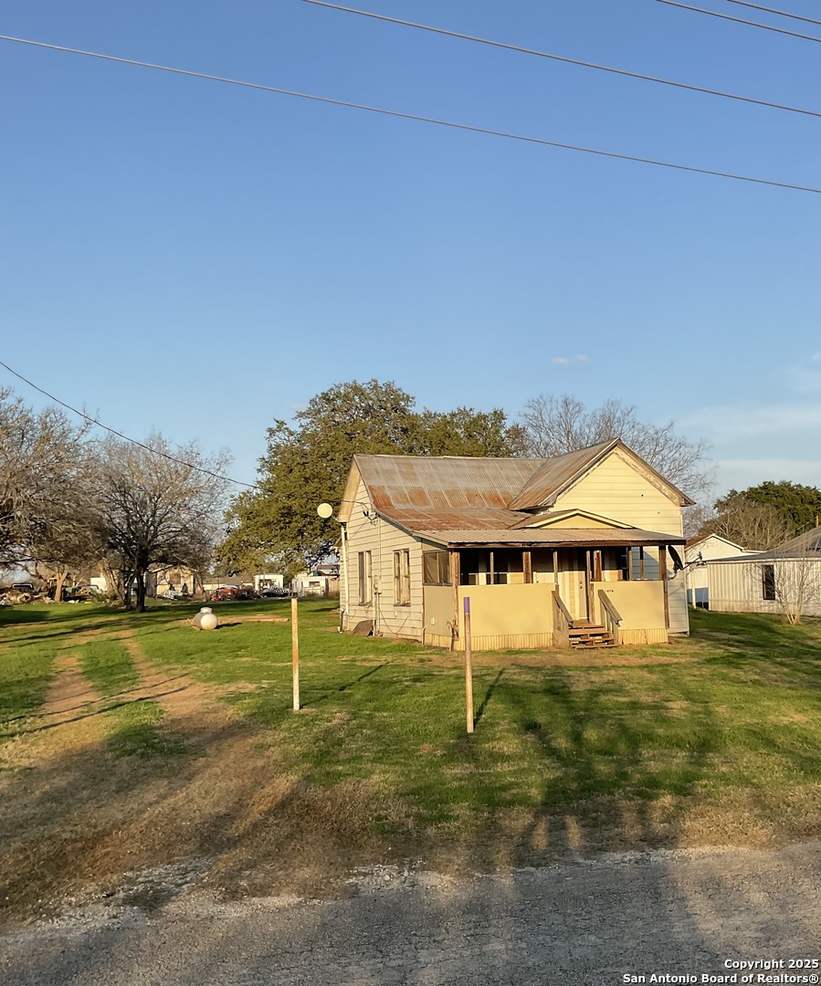 108 4th Street Sutherland Springs, TX 78161 - Photo 9 of 9 a front view of a house with a yard