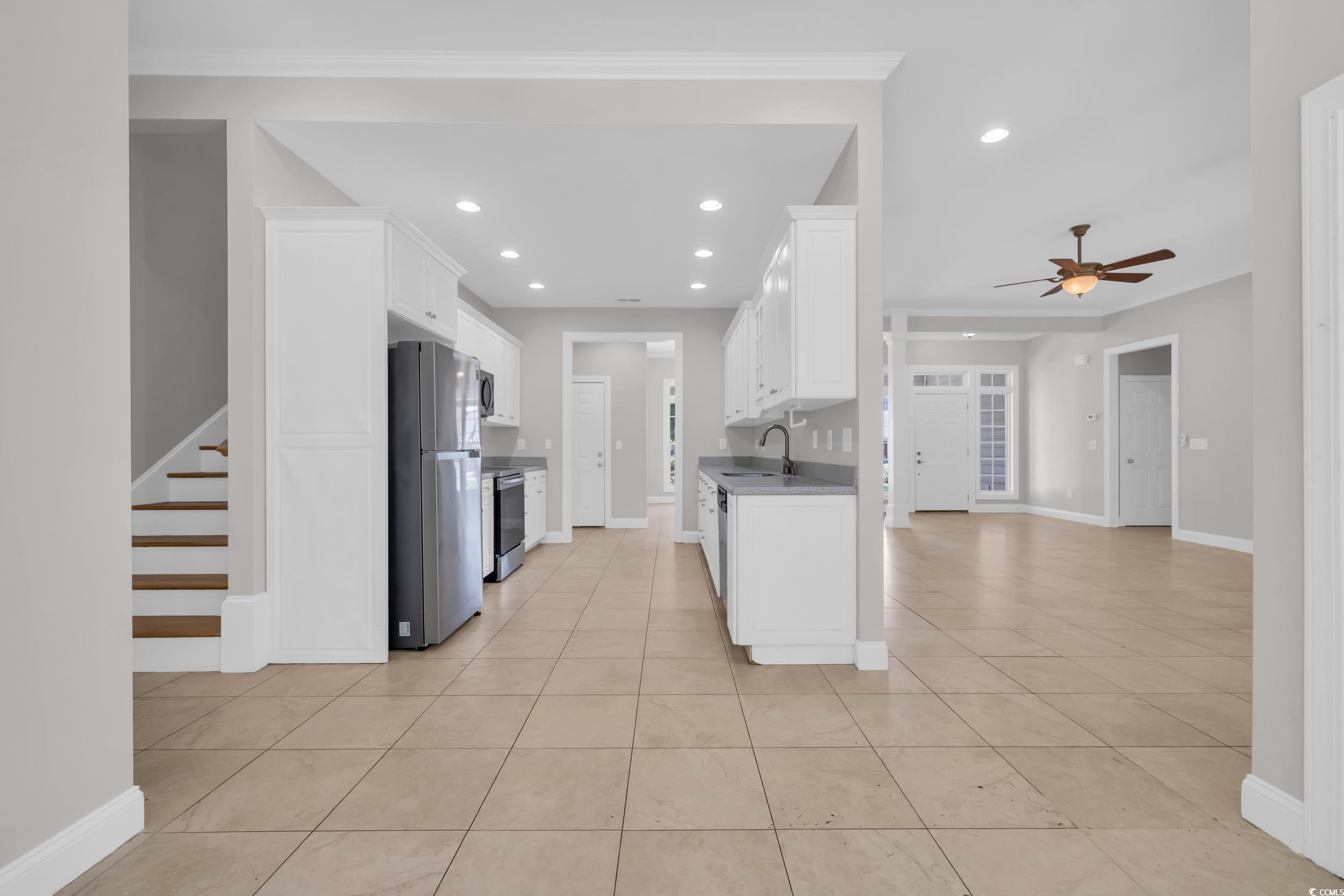 208 Lander Drive Conway, SC 29526 - Photo 16 of 40 Kitchen with white cabinetry, appliances with stainless steel finishes, recessed lighting, light tile patterned floors, and a ceiling fan