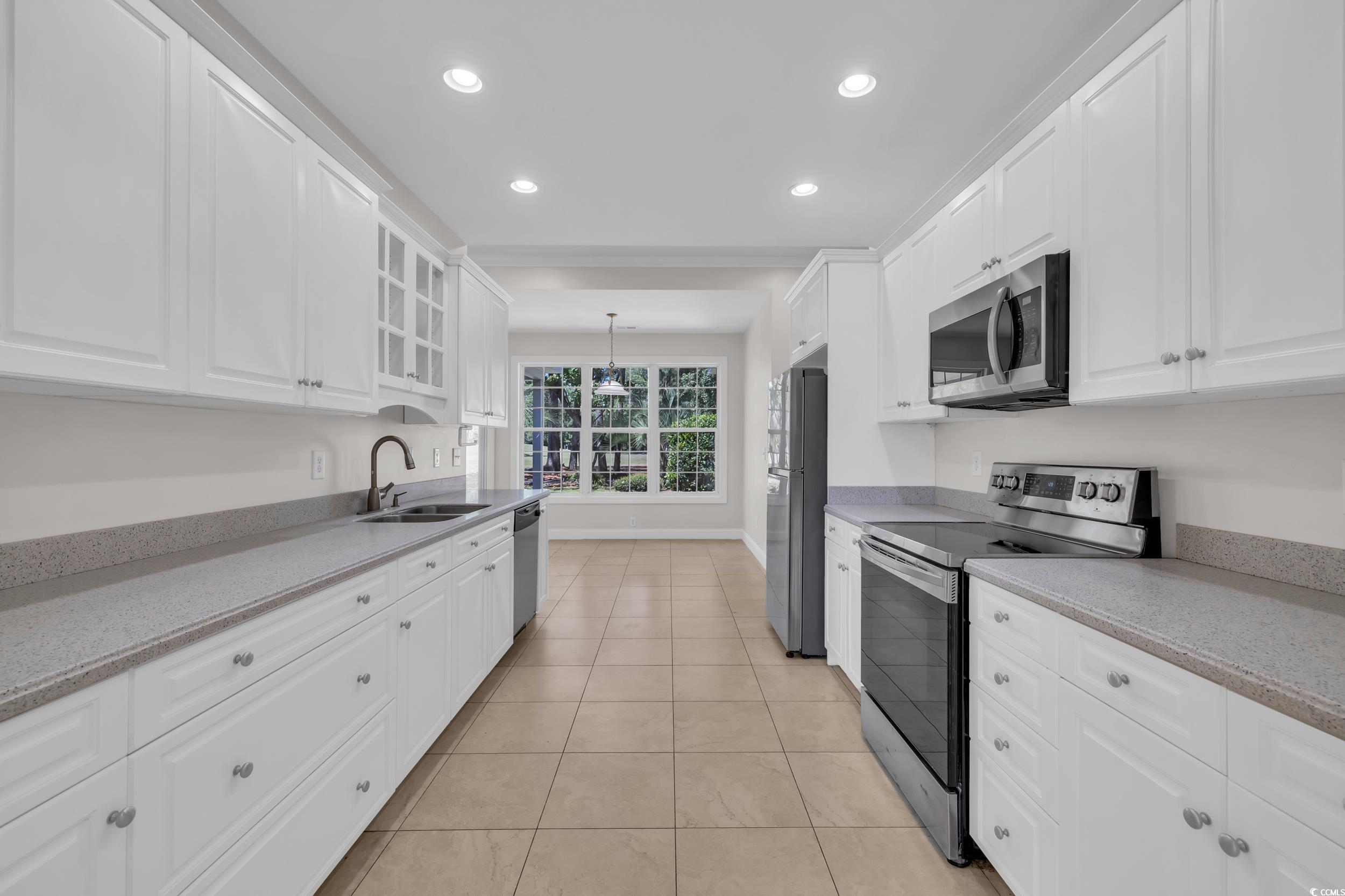 208 Lander Drive Conway, SC 29526 - Photo 17 of 40 Kitchen featuring stainless steel appliances, white cabinetry, light stone countertops, recessed lighting, and light tile patterned floors