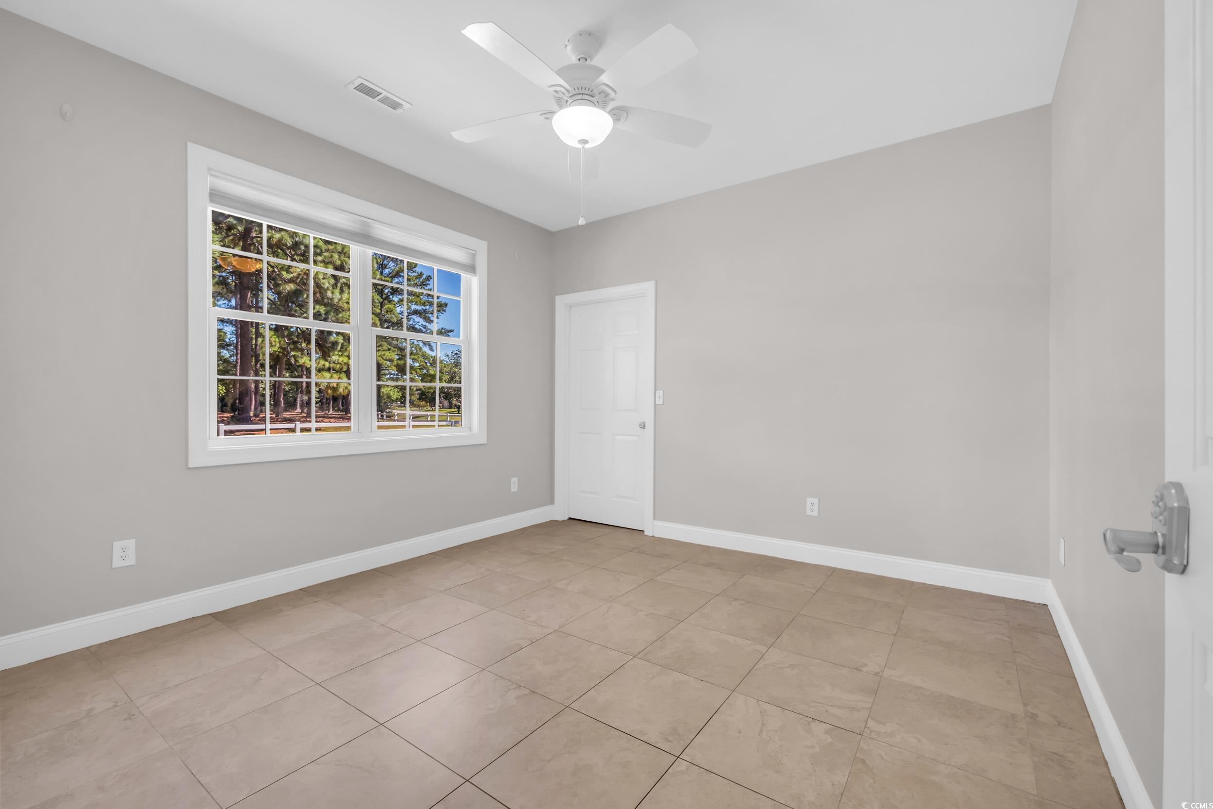 208 Lander Drive Conway, SC 29526 - Photo 22 of 40 Spare room featuring light tile patterned flooring and ceiling fan