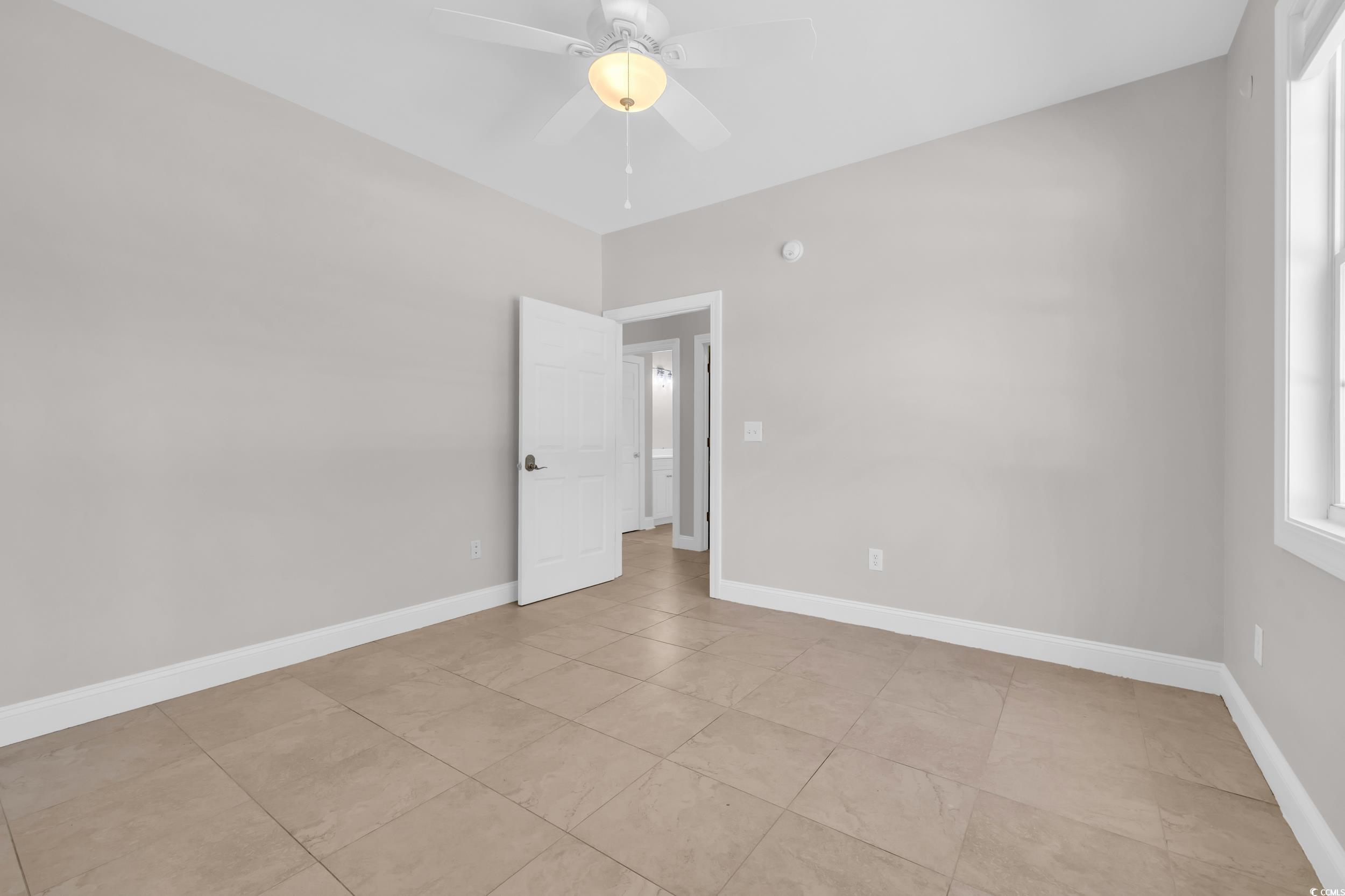 208 Lander Drive Conway, SC 29526 - Photo 23 of 40 Empty room featuring ceiling fan and light tile patterned floors