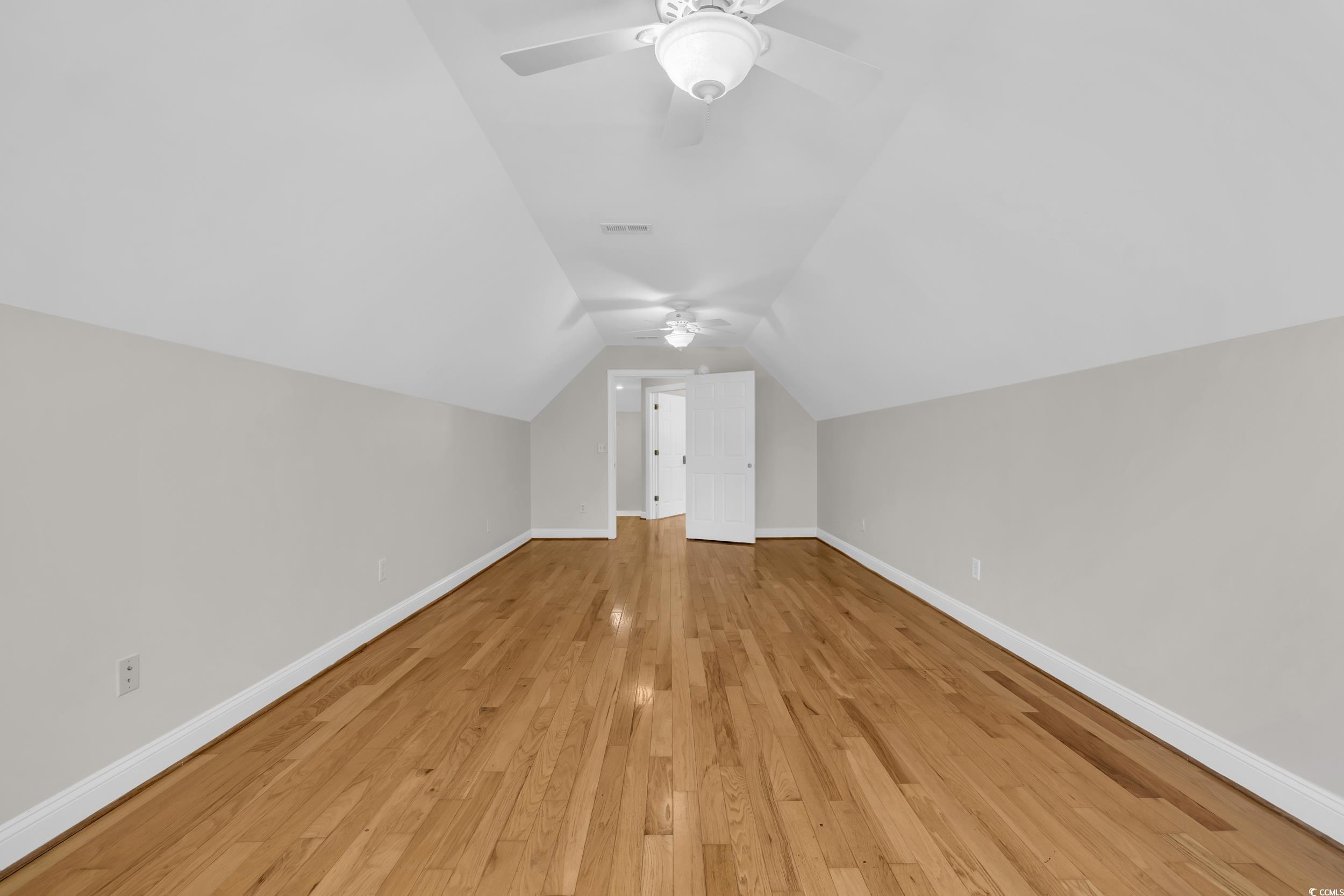 208 Lander Drive Conway, SC 29526 - Photo 26 of 40 Additional living space with vaulted ceiling, light wood-type flooring, and ceiling fan